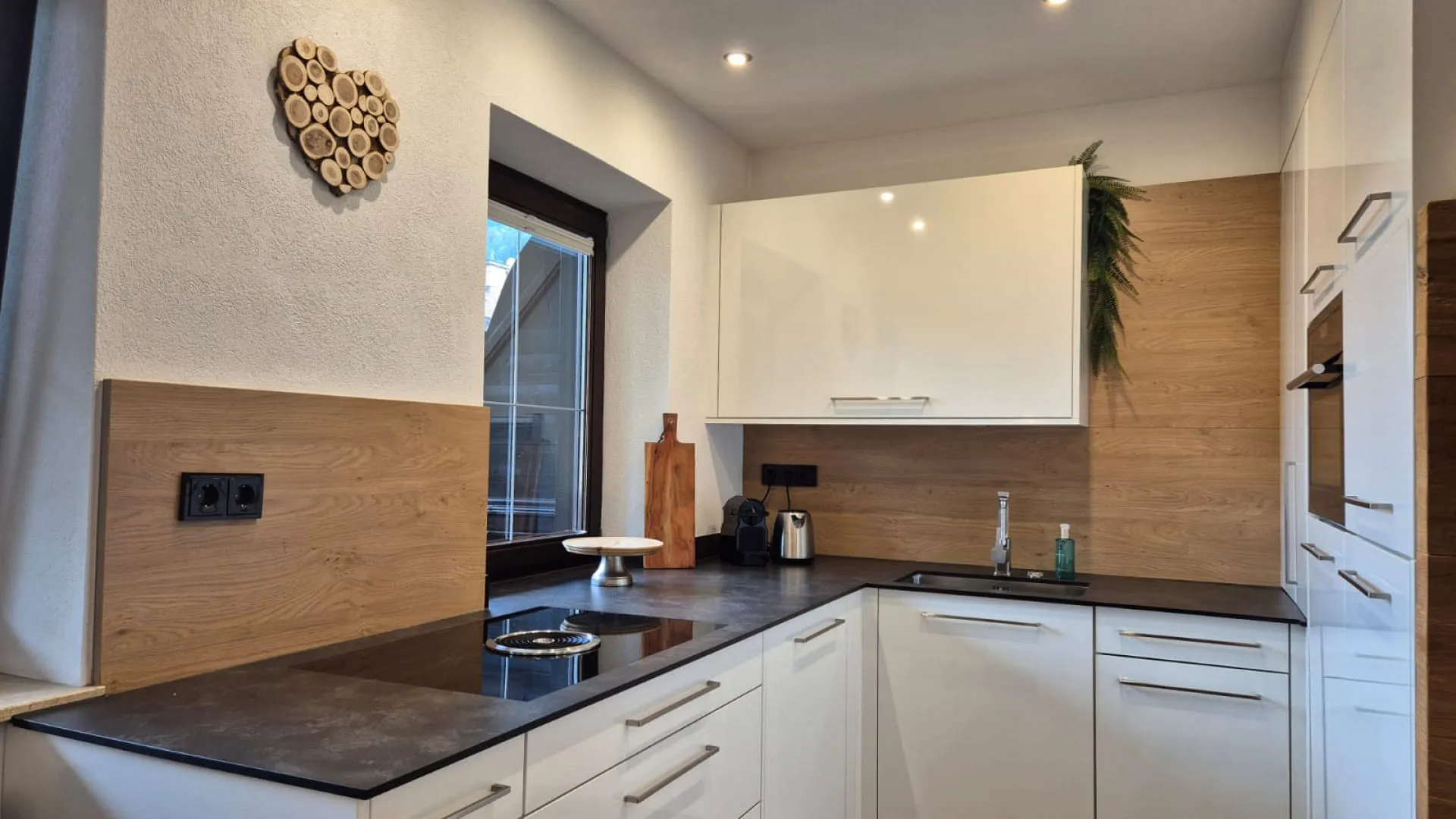 Modern kitchen with wooden details and a window